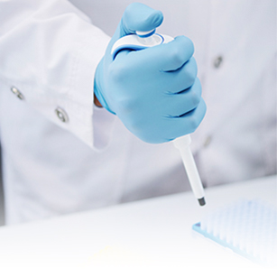 photo of someone holding a medical device for in-vitro testing